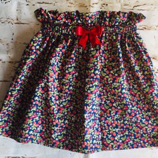 High Waisted Elasticated Skirt (6-7 years) in Navy cotton fabric with mini strawberries design, with a 8cm red bow
