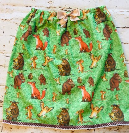 Elasticated Skirt (5-6 years) in Polly cotton fabric with Gruffalo Design, with a 8cm peach bow & spotty trim