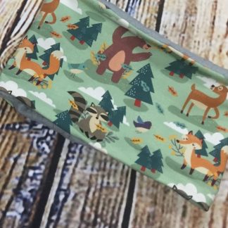 Snood/Neck warmer in dark green jersey fabric with forest animals